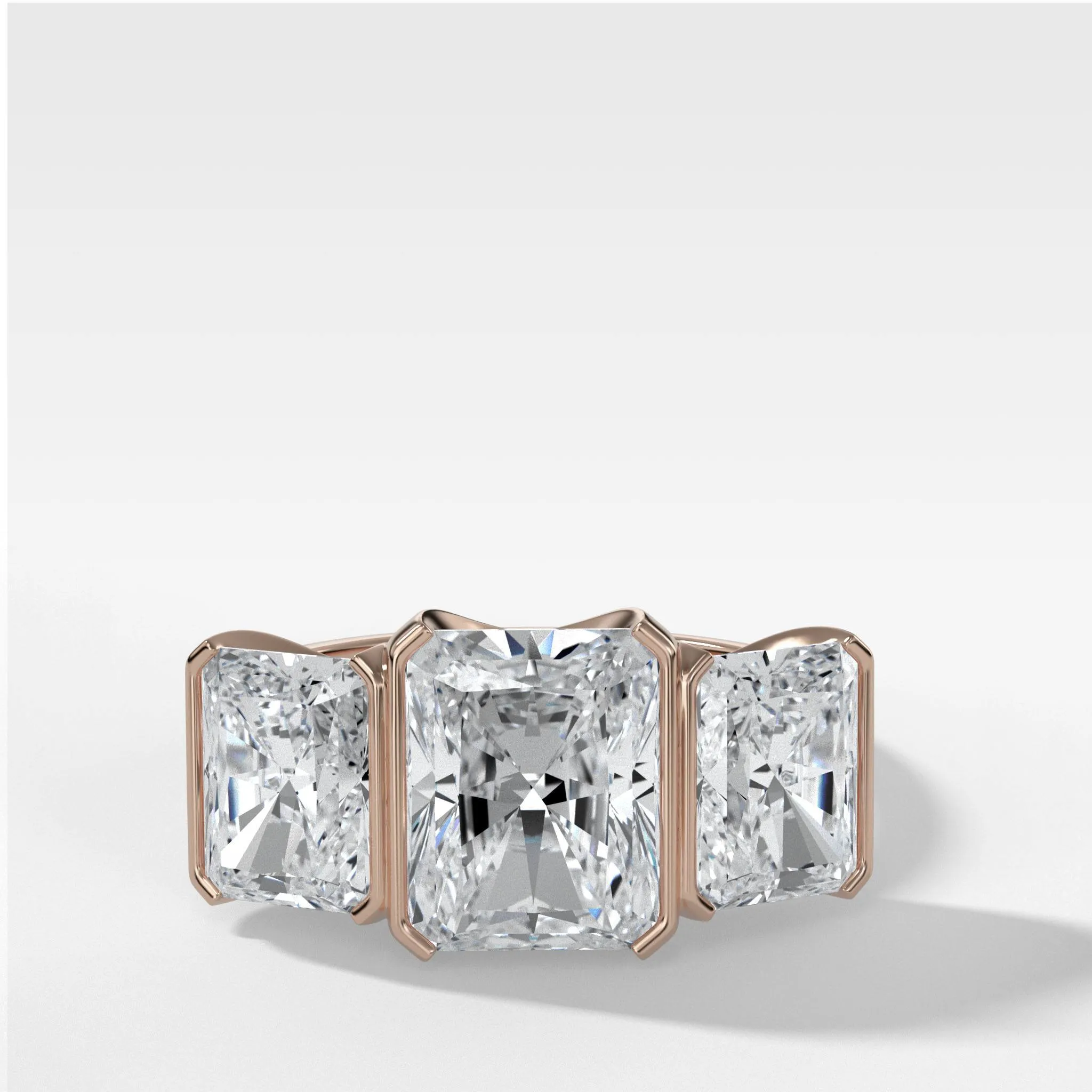 Half Bezel Triad Engagement Ring With Radiant Cut Diamonds