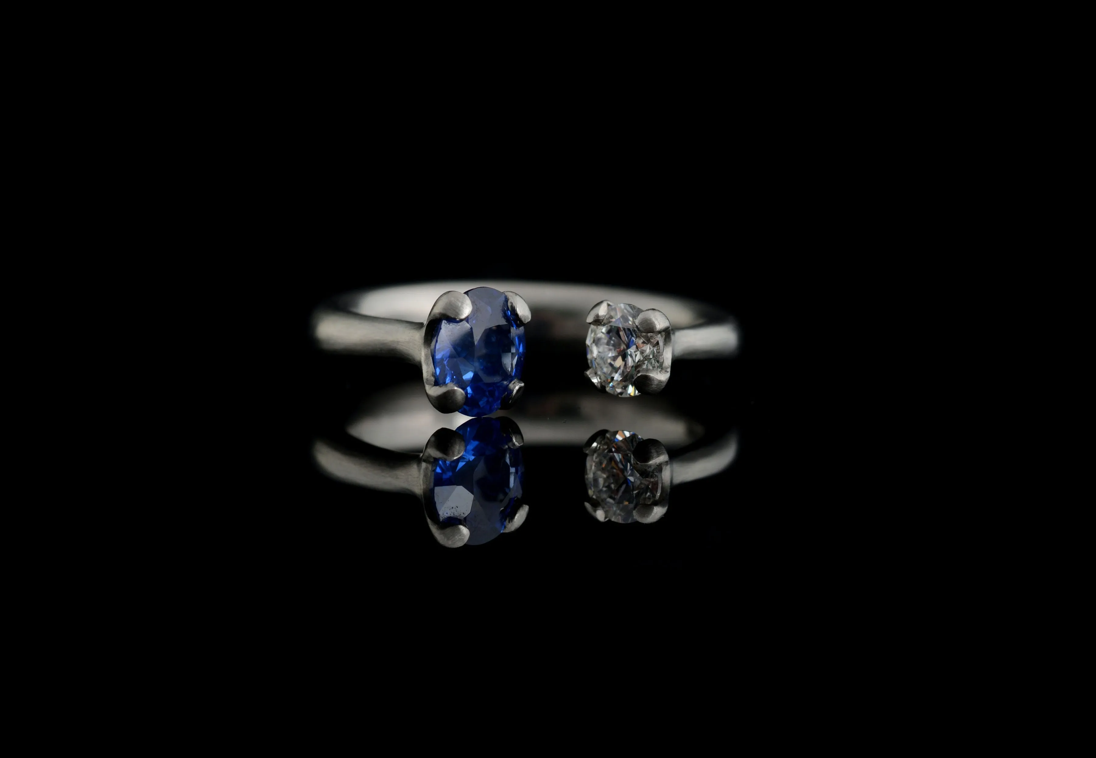 Platinum two-stone sapphire and diamond engagement ring