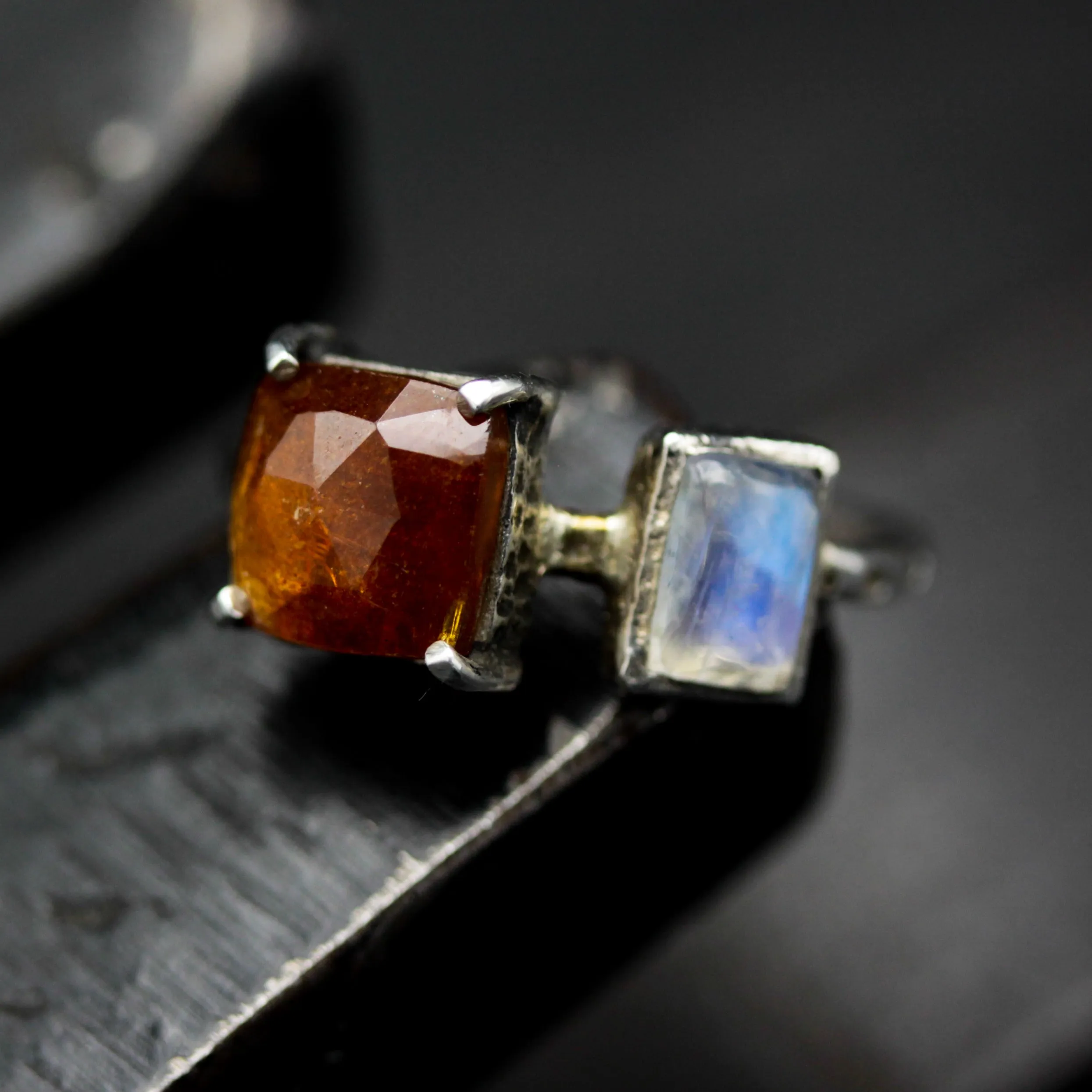 Square orange kyanite ring in silver bezel and prongs setting with Moonstone on the side on sterling silver texture band